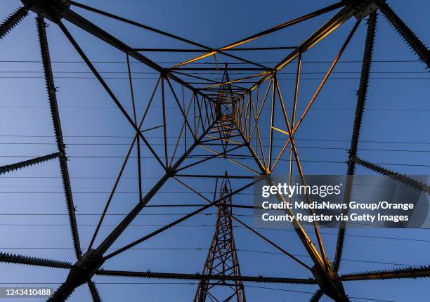 Power lines are seen through the bottom of a transmission tower at Talbert Park in Huntington Beach on Monday, September 19, 2022. The Orange County...