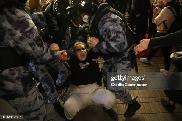 Russian Police officers detain detain a female protester during an unsanctioned protest rally at Arbat street on September 21 in Moscow, Russia. More...