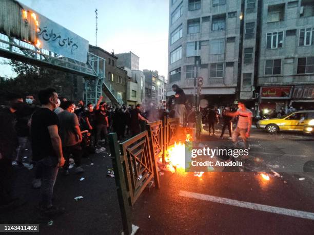 Dozens of people stage a demonstration to protest the death of a 22-year-old woman under custody in Tehran Iran on September 21, 2022.