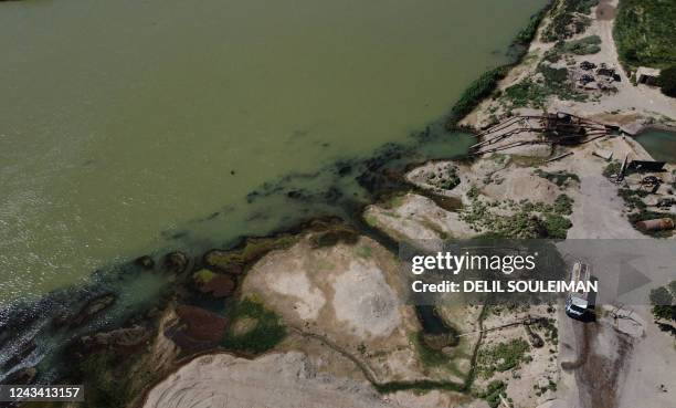 This aerial view shows a portion of the Euphrates River on September 17 a major source of contaminated water used for both drinking and irrigation,...