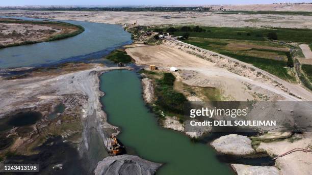 This aerial view shows a portion of the Euphrates River on September 17 a major source of contaminated water used for both drinking and irrigation,...