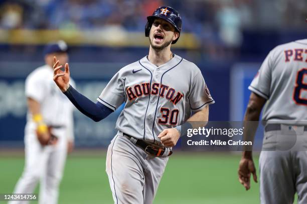 Kyle Tucker of the Houston Astros celebrates towards his dugout after hitting a two-run home run against the Tampa Bay Rays in the eighth inning...