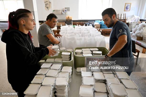 Volunteers prepare food at Mario Conte's San Francesco soup kitchen, which is helped by the Catholic Caritas charity, on September 20, 2022 in...