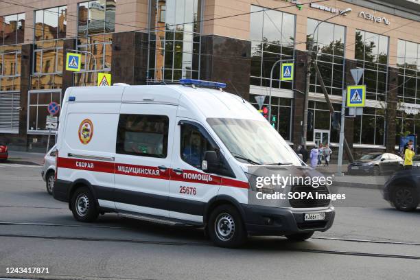 An ambulance drives along a street in St. Petersburg.