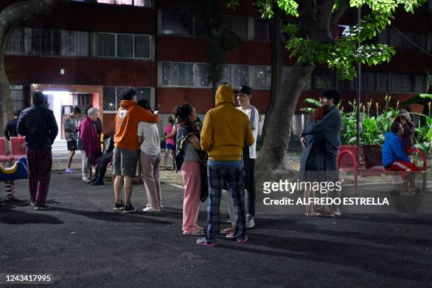 People are seen at the Tlatelolco neighborhood after a 6.8-magnitude earthquake in Mexico City on September 22, 2022.