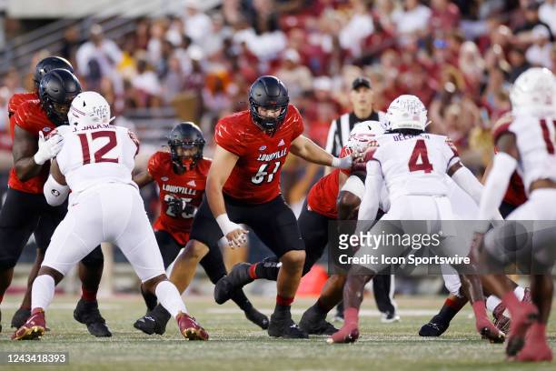 Louisville Cardinals offensive lineman Bryan Hudson blocks during a college football game against the Florida State Seminoles on September 16, 2022...
