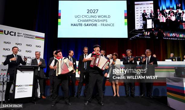 The French delegation celebrates after the announcement that Haute-Savoie in France will host the 2027 UCI Cycling World Championships, at the UCI...