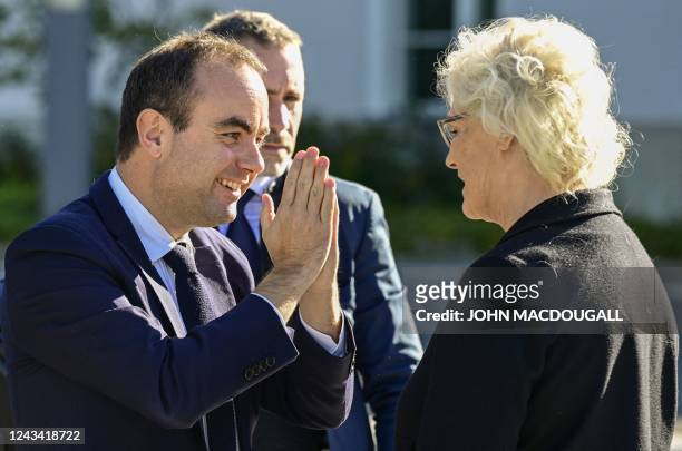 German Defence Minister Christine Lambrecht greets her new French counterpart Sebastien Lecornu upon his arrival, on September 22, 2022 in the...