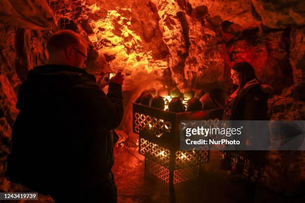 Visitors are taking pictures of dragon eggs inside the Dragon's Den under Wawel Castle as part of promo campaign of 'House of the Dragon', the new...