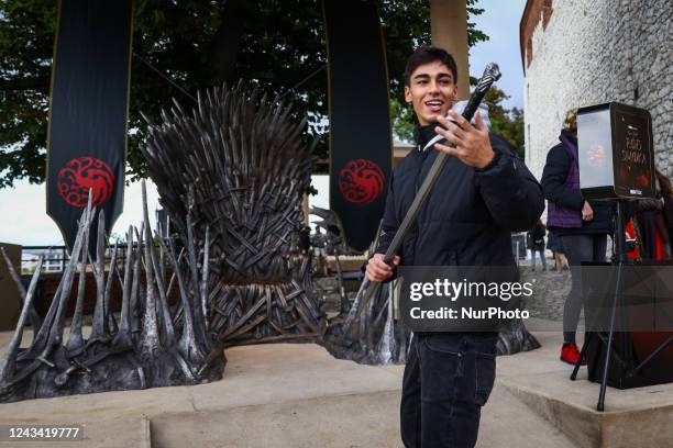 Visitors are taking a sit on the Iron Throne located at Wawel Castle as part of promo campaign of 'House of the Dragon', the new HBO prequel to 'Game...