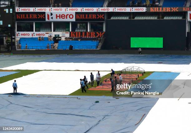 Ground staff mopping up as rain cancelled the India and Australia practice section at Vidarbha Cricket Association Stadium Jamtha on September 22,...