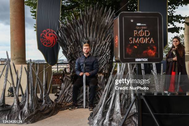 Visitors are taking a sit on the Iron Throne located at Wawel Castle as part of promo campaign of 'House of the Dragon', the new HBO prequel to 'Game...
