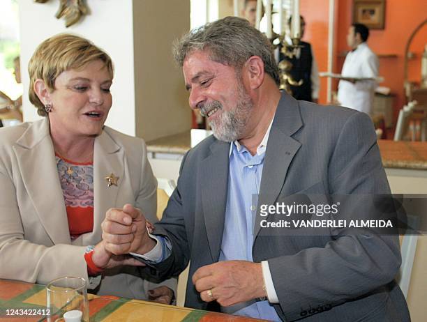 Luiz Inacio Lula da Silva , presidential candidate of the leftist Workers Party, and his wife Marisa embrace at a hotel restaurant 03 October 2002 in...
