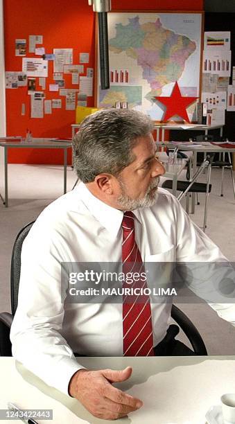 Brazilian presidential candidate of the Workers Party Luiz Inacio Lula da Silva pauses during a taping of a television advertisement for his...