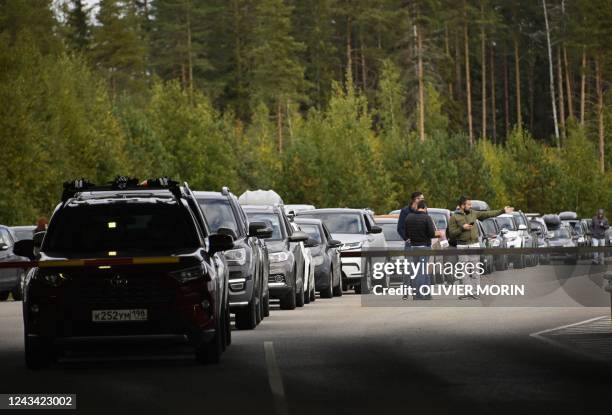 Cars coming from Russia wait in long lines at the border checkpoint between Russia and Finland near Vaalimaa, on September 22, 2022. - Finland said...