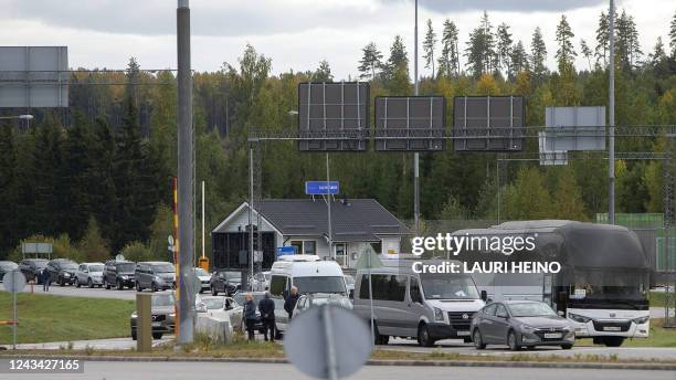 Vehicles queue to cross the border from Russia to Finland at the Nuijamaa border checkpoint in Lappeenranta, Finland, on September 22, 2022. -...
