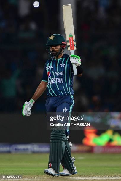 Pakistan's captain Babar Azam celebrates after scoring half century during the second Twenty20 international cricket match between Pakistan and...