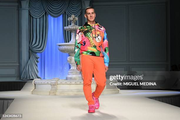 Fashion designer Jeremy Scott acknowledges applause following the presentation of Moschino's Women's Spring Summer 2023 fashion collection on...