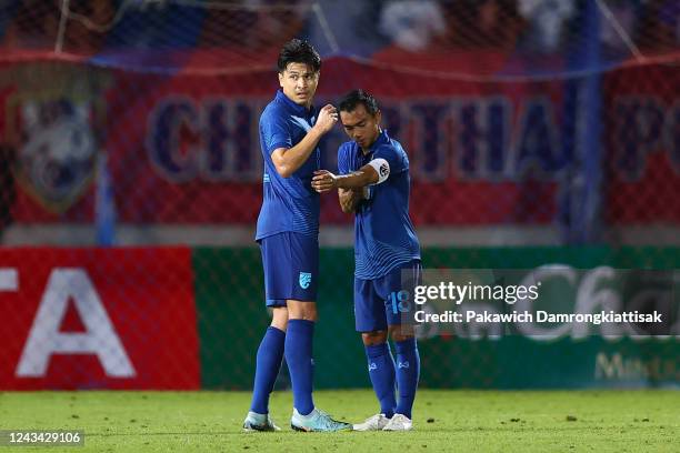 Chanathip Songkrasin of Thailand hands Thitiphan Puangjan the captain armband during the international friendly match between Thailand and Malaysia...