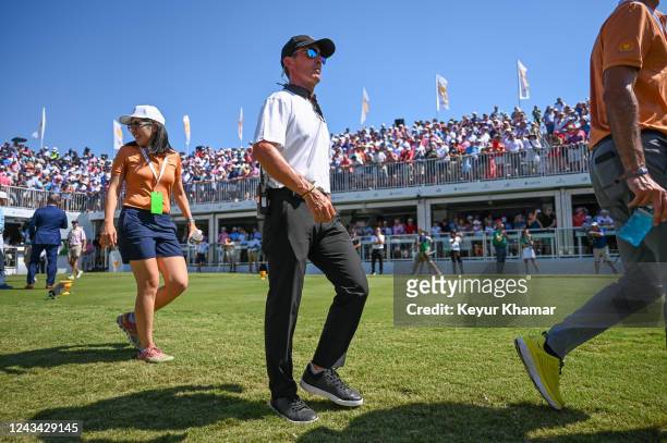 International Team Assistant Captain Mike Weir of Canada walks off the first tee during the first round of Presidents Cup at Quail Hollow September...