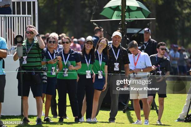 Staff watch the Opening Ceremony and Trophy presentation on the first tee during the first round of Presidents Cup at Quail Hollow September 22 in...