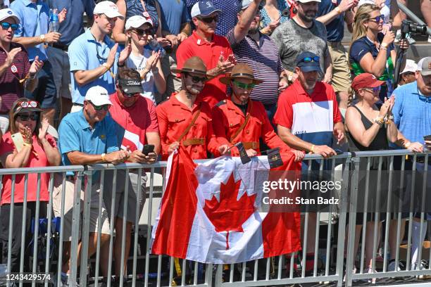 Fans watch the Opening Ceremony and Trophy presentation on the first tee during the first round of Presidents Cup at Quail Hollow September 22 in...