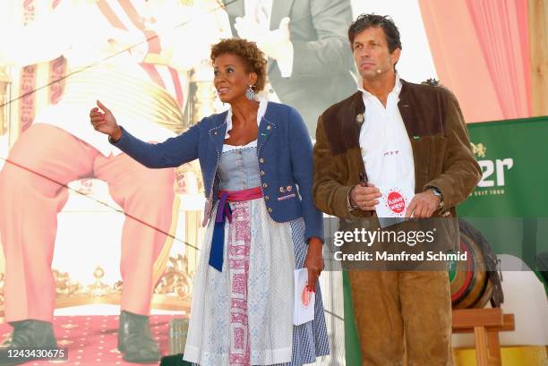 Arabella Kiesbauer and Martin Ferdiny speak during the Kaiser Wiesn opening at Prater Kaiserwiese on September 22, 2022 in Vienna, Austria.