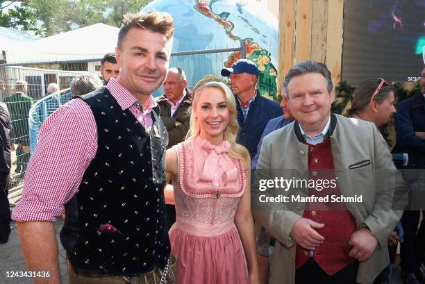 Leo Hillinger, Silvia Schneider and Michael Ludwig major of Vienna pose during the Kaiser Wiesn opening at Prater Kaiserwiese on September 22, 2022...