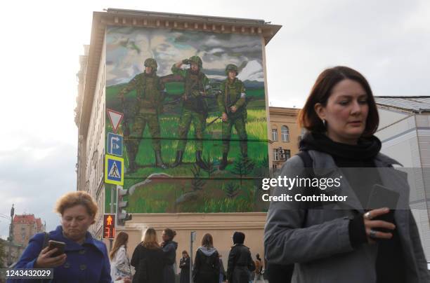 Giant pro-war mural showing three soldiers in camouflage with weapons, emblazoned with the words "For Russia" with the letter "Z", is seen is seen on...
