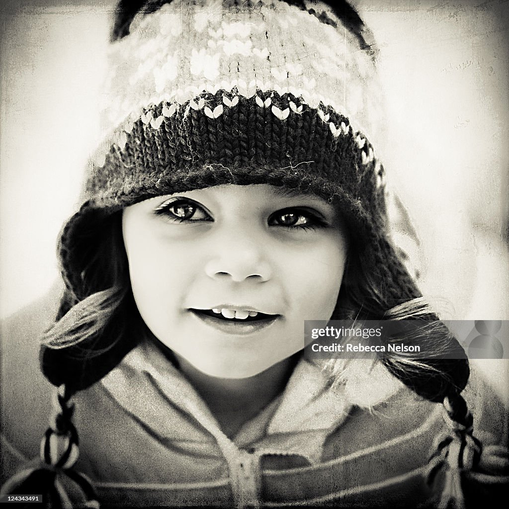 Toddler girl in coat and hat