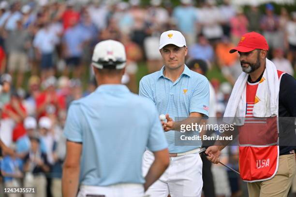 Team members Jordan Spieth and Justin Thomas celebrate Justins putt on the 15th hole during the first round of Presidents Cup at Quail Hollow...