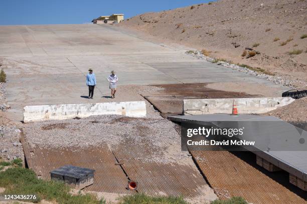 Disused dock at the bottom of a boat ramp that no longer reaches water is seen as unprecedented drought reduces Colorado River and Lake Mead to...