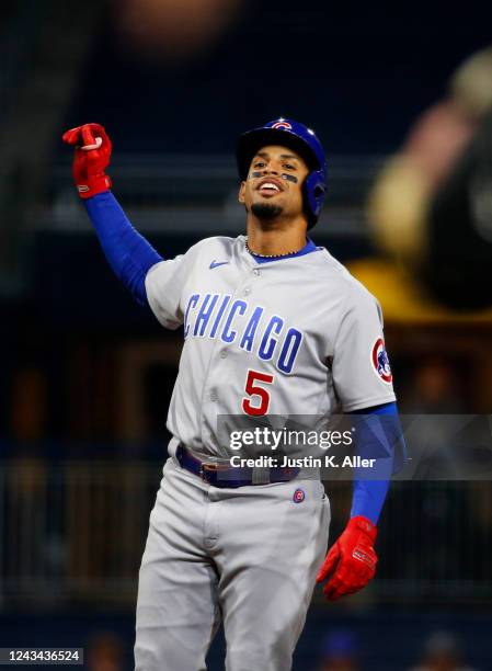 Christopher Morel of the Chicago Cubs reacts after hitting a two RBI double in the second inning against the Pittsburgh Pirates during the game at...