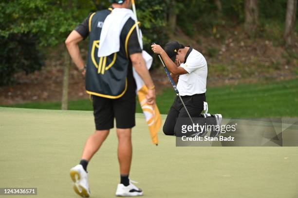 International Team player Si Woo Kim of South Korea goes down to his knees after failing to make a birdie putt on the ninth hole during the first...