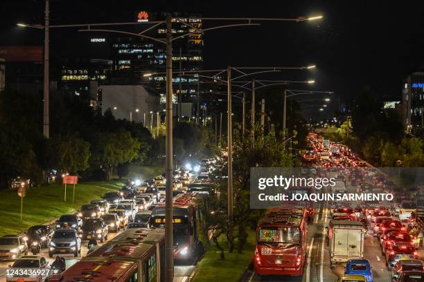 Heavy traffic is seen on an avenue in Bogota, on September 16, 2022. - From dawn, it is an uninterrupted flow: hundreds of cyclists circulate between...