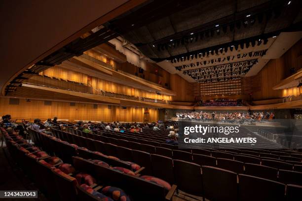 The New York Philharmonic rehearses at David Geffen Hall in Lincoln Center on September 19 in New York City. - The New York Philharmonic is getting...