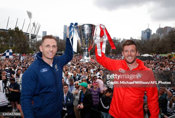 Joel Selwood of the Cats and Luke Parker of the Swans pose with the Premiership Cup during the 2022 Toyota AFL Grand Final Parade on September 23,...