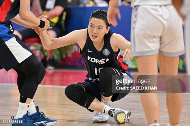 South Korea's Kim So-dam recovers after falling on the court during the Women's Basketball World Cup group A game between South Korea and Belgium in...