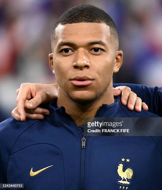 France's forward Kylian Mbappe stands for the national anthem prior to the start of the UEFA Nations League, League A Group 1 football match between...