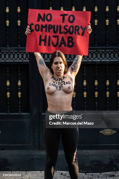 Activist of feminist group FEMEN protesting bare-chested outside of the Embassy of Iran against the death of Iranian woman Mahsa Amini. Mahsa Amini...