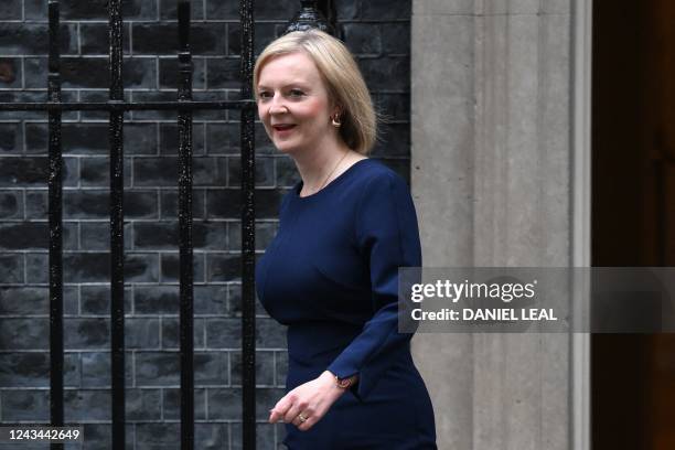 Britain's Prime Minister Liz Truss walks out of Number 10 Downing Street on her way to the House of Commons for the government's anti-inflation...