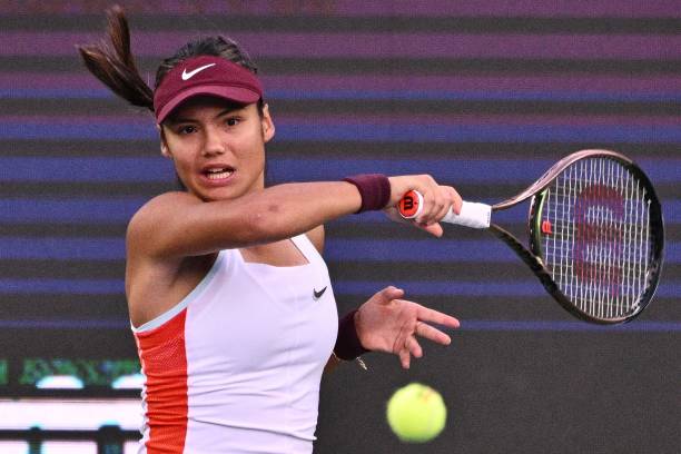 Emma Raducanu of Britain returns the ball against Magda Linette of Poland during the women's quarter final match at the Korea Open tennis...