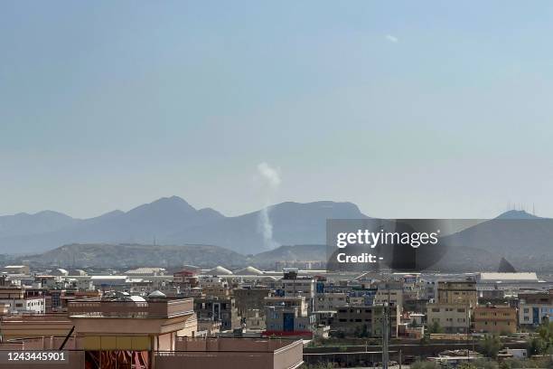 Smoke bellows from a site of a blast near the Wazir Mohammad Akbar Khan Mosque that reportedly happened as people were leaving the mosque after...