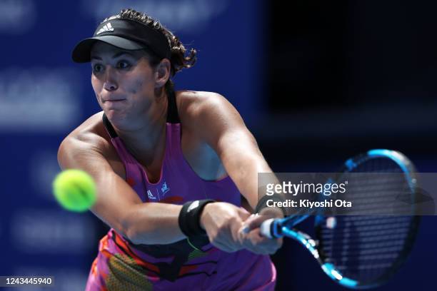 Garbine Muguruza of Spain plays a backhand in the Singles quarterfinal match against Ludmilla Samsonova of Russia during day five of the Toray Pan...
