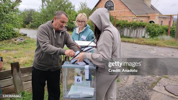 Residents cast their votes in controversial referendums in the city of Dokuchaievsk, Donetsk Oblast, Ukraine on September 23, 2022. Voting will run...