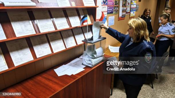 Residents cast their votes in controversial referendums in the city of Dokuchaievsk, Donetsk Oblast, Ukraine on September 23, 2022. Voting will run...