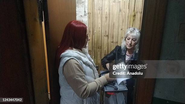 Residents cast their votes in controversial referendums in the city of Dokuchaievsk, Donetsk Oblast, Ukraine on September 23, 2022. Voting will run...