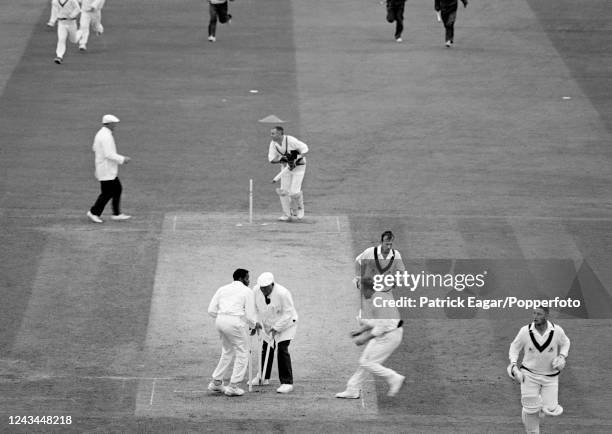 Derbyshire players Karl Krikken and Frank Griffith grab souvenir stumps as Derbyshire win the Benson and Hedges Cup Final between Derbyshire and...