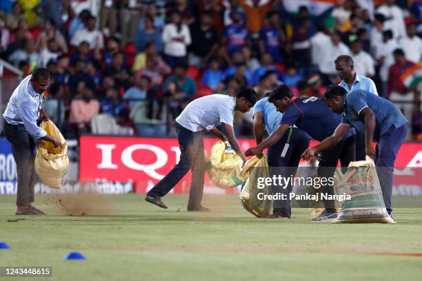 Grounds crew work as toss is delayed due to a wet outfield prior to game two of the T20 International series between India and Australia at Vidarbha...