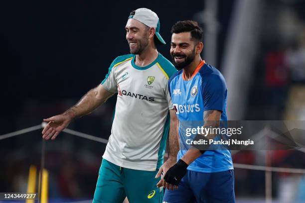 Virat Kohli of India and Glenn Maxwell of Australia interact prior to game two of the T20 International series between India and Australia at...